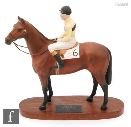 A Beswick Connoisseur model of Arkle with Pat Taaffe up, mounted to an oval wooden plinth, height