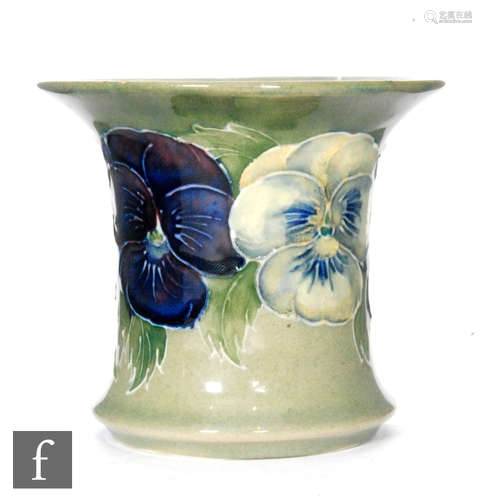 A small William Moorcroft posy vase of flared form decorated in the Pansy pattern with tubelined