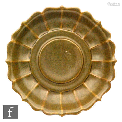 A Chinese teadust glazed 'lotus' bowl, the ribbed sides issuing from central stepped circular