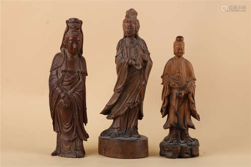 A SET OF THREE CHINESE CARVED WOOD FIGURE OF GUANYIN, QING DYNASTY