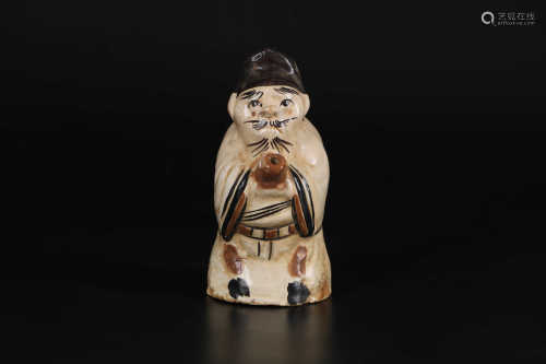 A CHINESE â€˜CIZHOUâ€™ WARE FIGURE-SHAPED INCENSE HOLDER, SONG DYNASTY