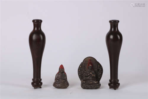 A PAIR OF ROSEWOOD VASES WITH A PAIR OF BRONZE FIGURE OF BUDDHA, QING DYNASTY