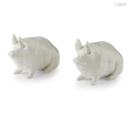 A PAIR OF SMALL WEMYSS WARE PIGS EARLY 20TH CENTURY each covered in a white glaze, apparently