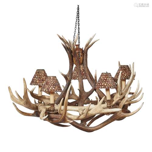 AN ANTLER CHANDELIER CONTEMPORARY the entwined antlers supporting five brass sconces, each fitted