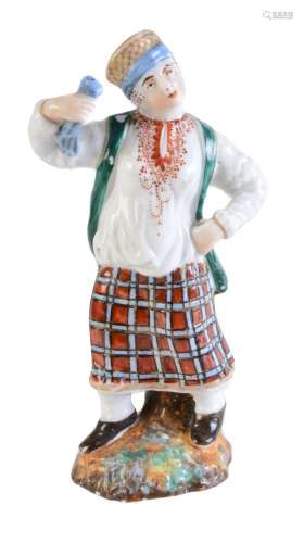 A Russian porcelain figure of a peasant woman