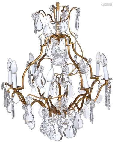 A gilt metal and cut glass hung eight light chandelier in Louis XV style