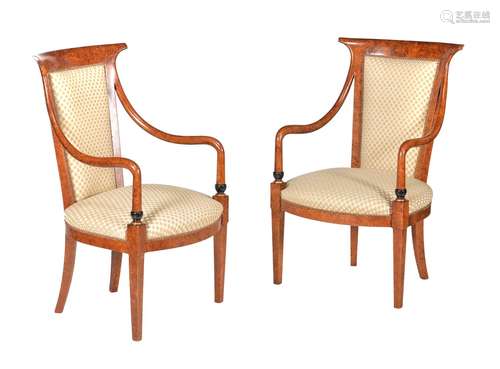 A pair of simulated amboyna and upholstered armchairs