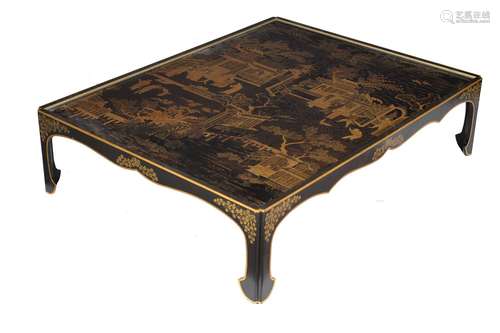 An ebonised, black lacquer and gilt Chinoiserie decorated low table