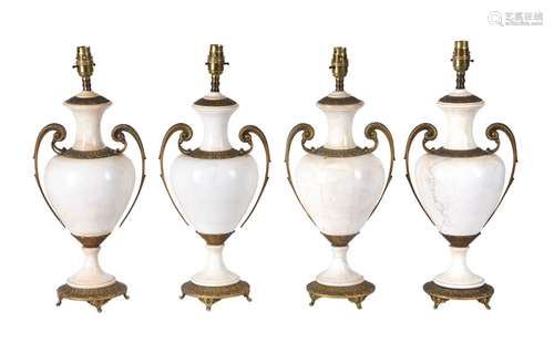 A set of four Continental gilt metal mounted glazed ceramic table lamps