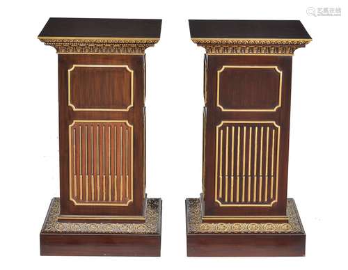 A pair of stained wood and parcel gilt pedestals