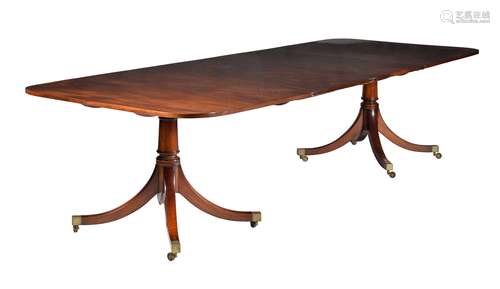 A mahogany twin pillar dining table in late George III style