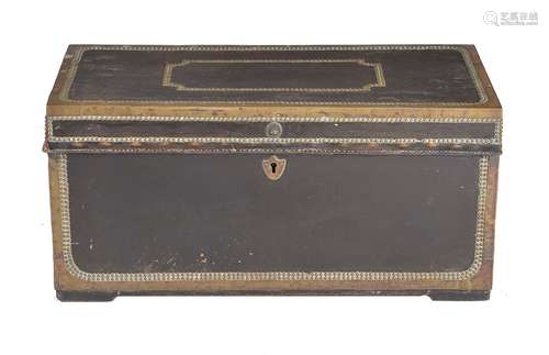 A leather and brass bound camphorwood trunk