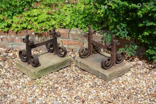 A pair of substantial Victorian wrought iron and limestone mounted boot scrapes