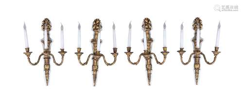 A set of four painted composition three light wall appliques in Louis XVI taste