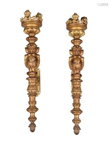 A pair of gilt bronze three light wall torcheres in Baroque taste