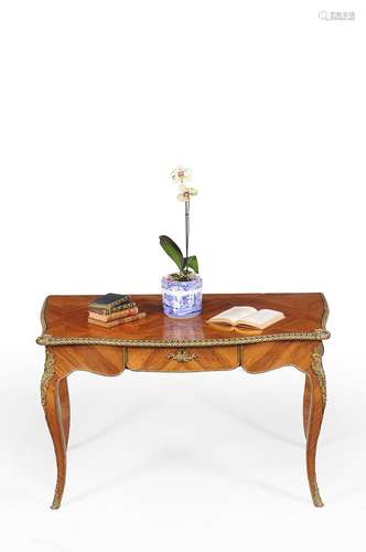 ϒ A French tulipwood and gilt metal mounted bureau plat