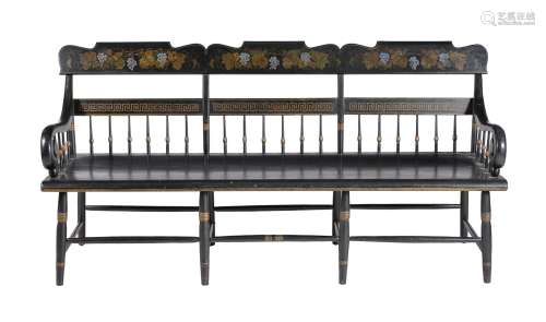 An ebonised, parcel gilt and painted chair back settee or hall bench