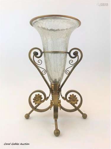 Antique flower vase of bronce and worked glass.