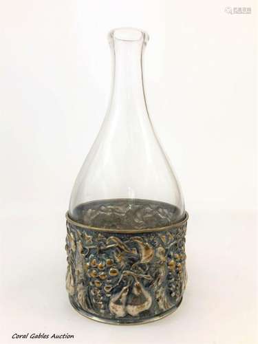 Antique glass bottle with silver plated base