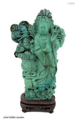 TURQUOISE CARVED SCULPTURE WITH WOOD BASE