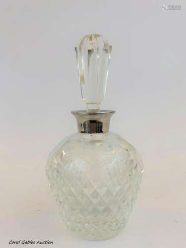 Liquor bottle with sterling silver details.