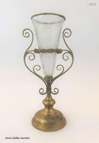 Antique flower vase of brass and worked glass.