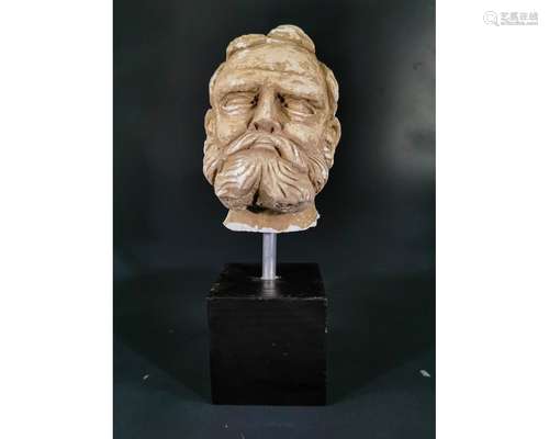 GANDHARA STUCCO HEAD OF A BEARDED MAN