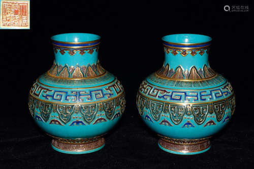 A PAIR OF GREEN GLAZE POTS OF PINE TREE WITH QIANLONG MARKING