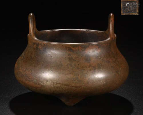 A BRONZE TRI-POD DOUBLE EAR CENSER