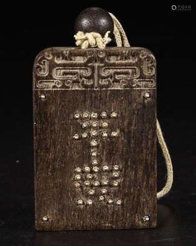 A CHENXIANG WOOD   AUSPICIOS PATTERN CARVED  PENDANT