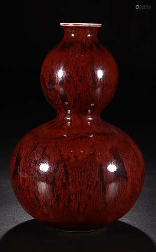 A RED GLAZE GOURD SHAPED VASE