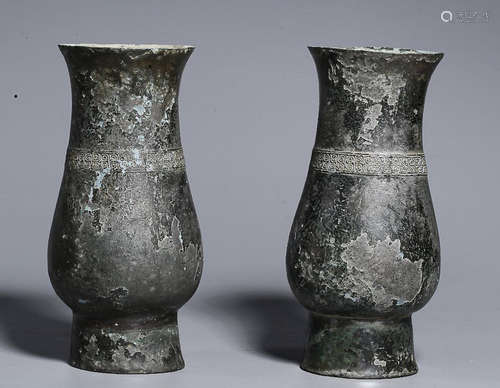 A PAIR OF BRONZE VASES