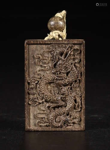 A CHENXIANG WOOD CARVED DRAGON PENDANT