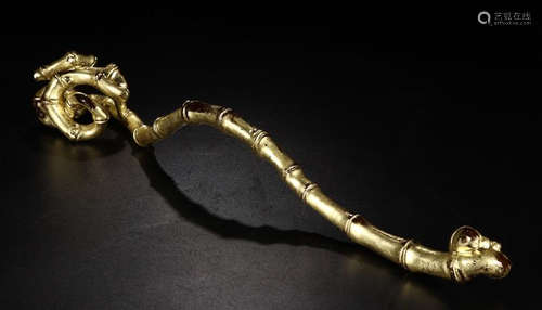 A GILT BRONZE BAMBOO SHAPED RUYI ORNAMENT