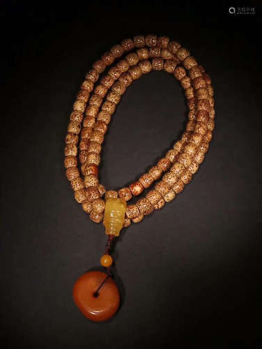 TIBETAN BODHI AND PIE-SHAPE AMBER BEADS 108