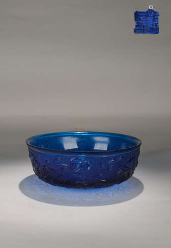 A GLASS BOWL WITH TIGER CARVING