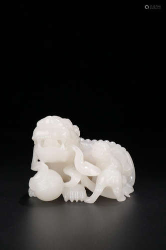 A HETIAN WHITE JADE LION ORNAMENT