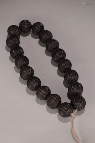 A CHENXIANG WOOD BRACELET WITH 18 BEADS