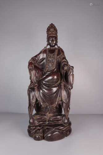 A ZITAN WOOD GUANYIN SHAPED ORNAMENT