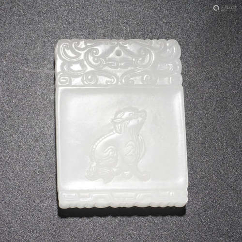 A HETIAN JADE TABLET WITH BEAST CARVING