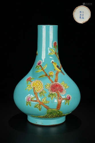 A GREEN GLAZED VASE OF FLORAL DESIGNED