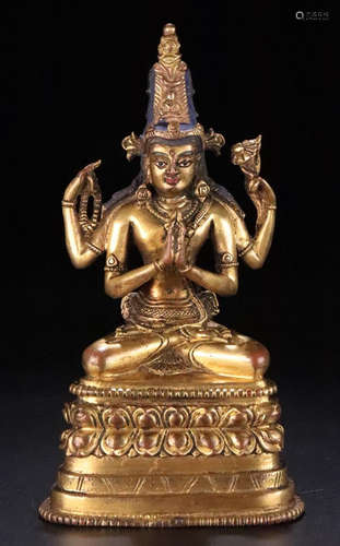 A TIBETAN GILT BRONZE CASTED MULTI ARMS BUDDHA