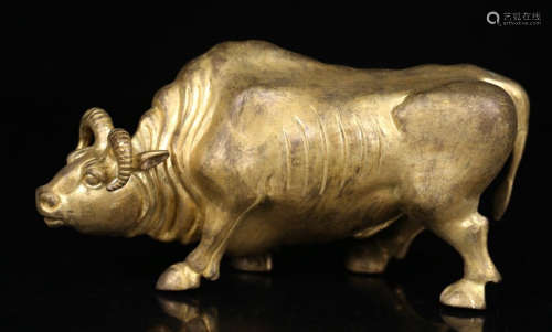 A BRONZE CASTED COW SHAPED PENDANT