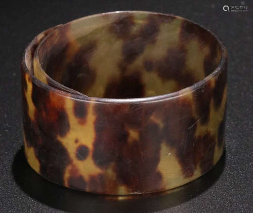 A DAIMAO CARVED OLD BANGLE