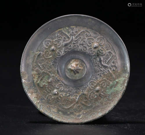 A SILVER FLOWER PATTERN MIRROR