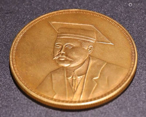 A GOLD CASTED HEAD PATTERN COIN