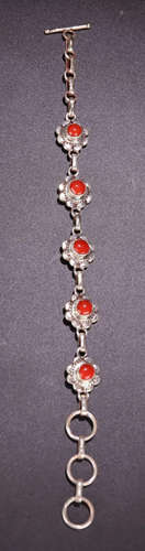 A TIBETAN SILVER WITH CORAL BRACELET