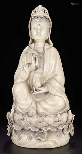 A WHITE GLAZE GUANYIN BUDDHA