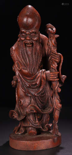 A BAMBOO CARVED LIFELESS BUDDHA