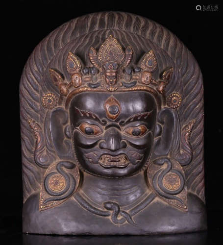 A TIBETAN BLACK STONE CARVED MINGWANG BUDDHA